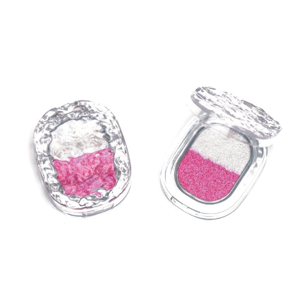 Two dome shaped glitter eyeshadow compacts with silver shells