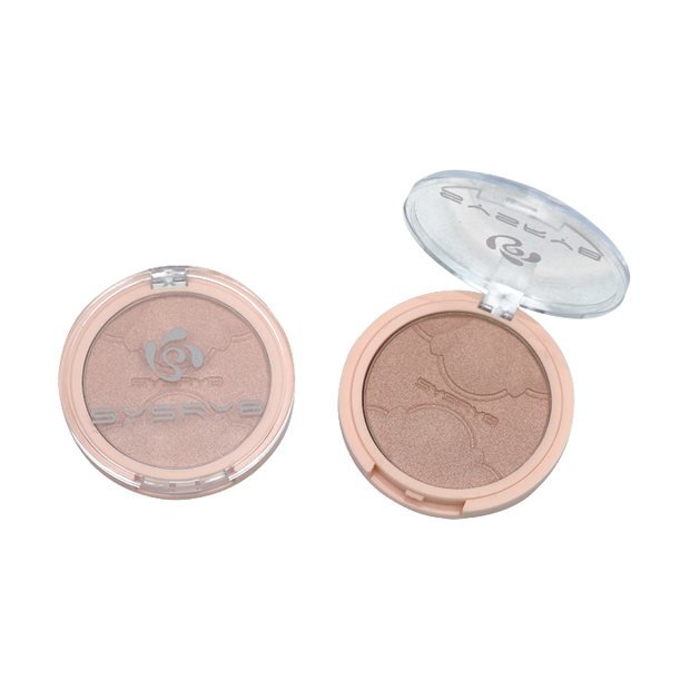 Round highlighter compact with champagne shimmer