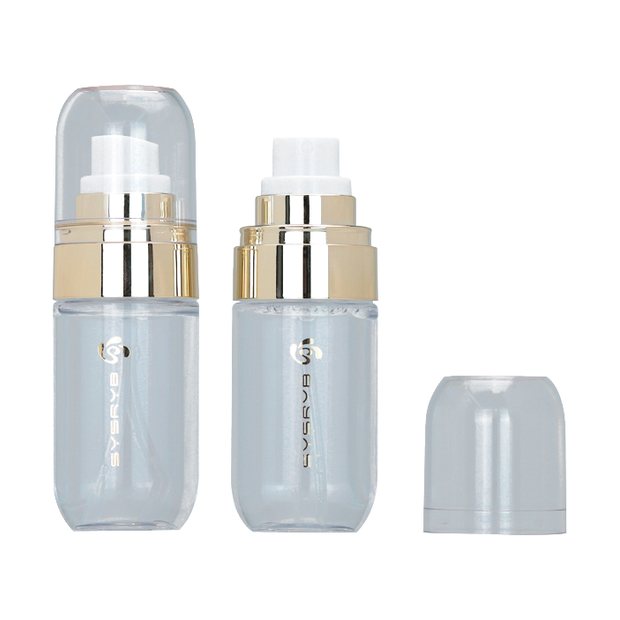 Clear skincare bottle with gold pump collar