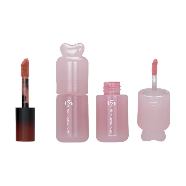 Dusty pink lip gloss bottles with bow shaped caps and silicone brush